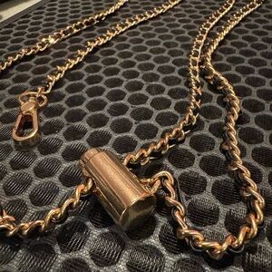 Elegant Gold Chain with black Leather Strap